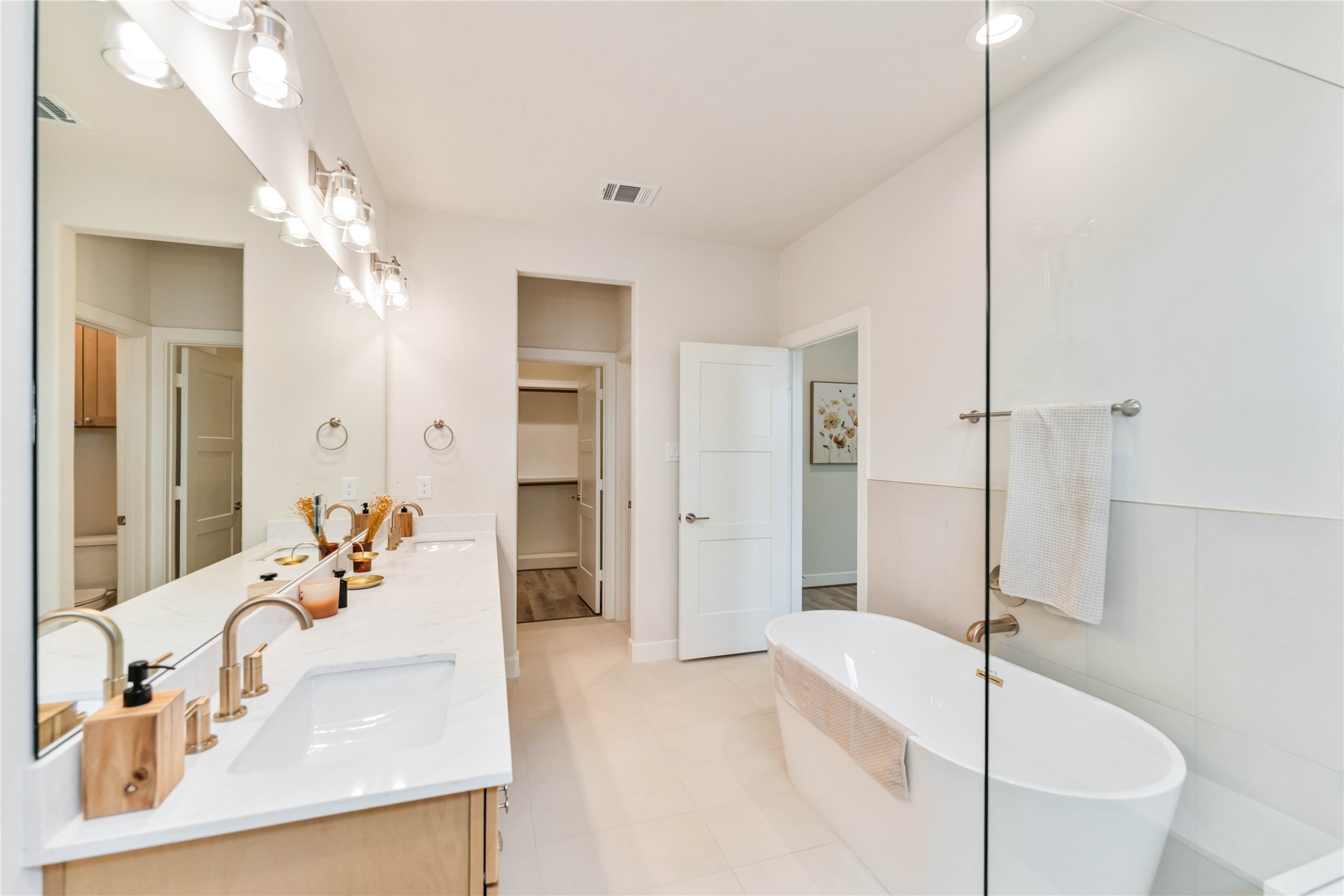 11108 Bauman Road Houston, TX 77076 - Photo 15 of 25 a bathroom with a tub sink and mirror