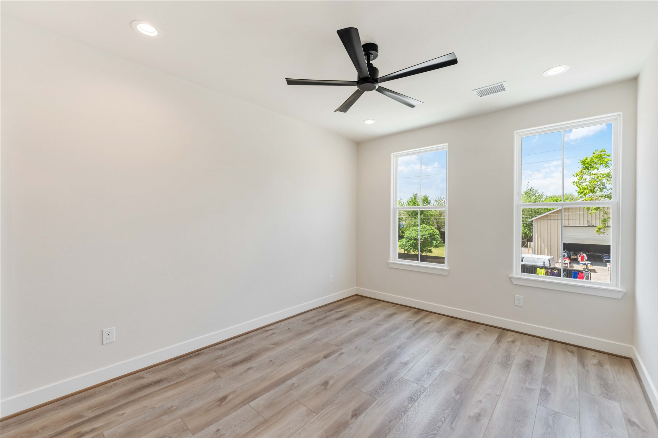 11108 Bauman Road Houston, TX 77076 - Photo 19 of 25 wooden floor in an empty room with a window
