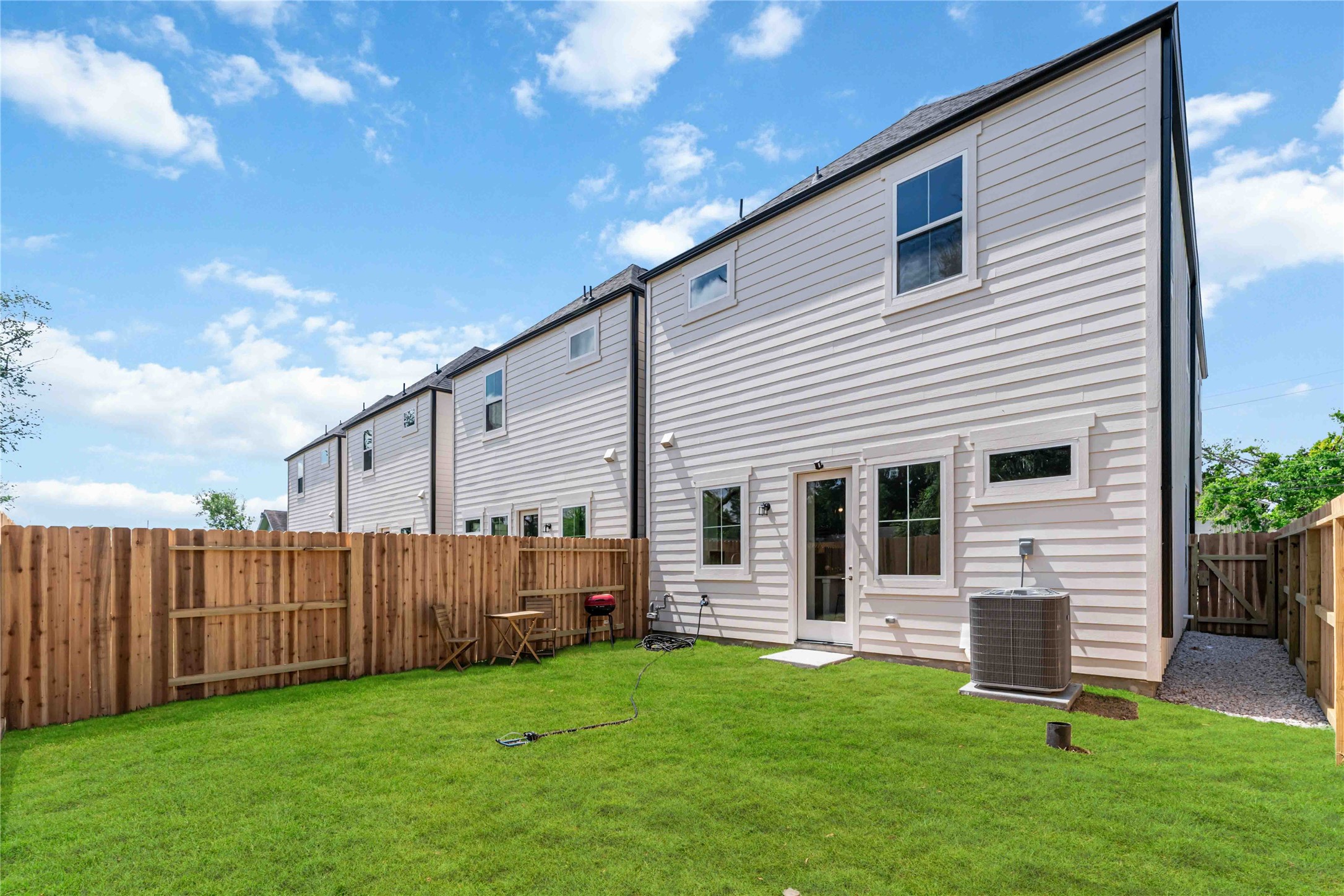 11108 Bauman Road Houston, TX 77076 - Photo 24 of 25 a backyard of a house with table and chairs