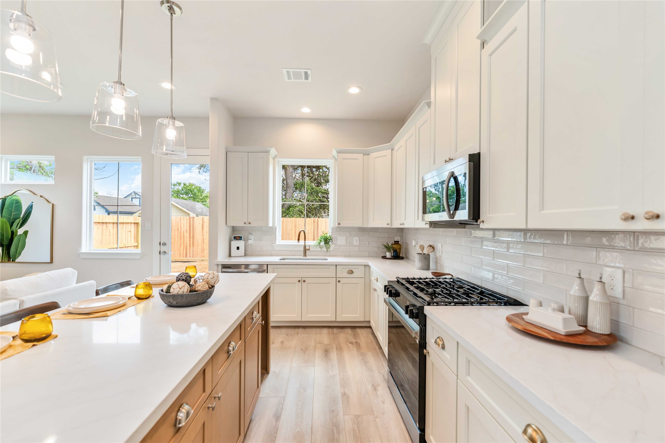 11108 Bauman Road Houston, TX 77076 - Photo 5 of 25 a kitchen with a sink stove and cabinets