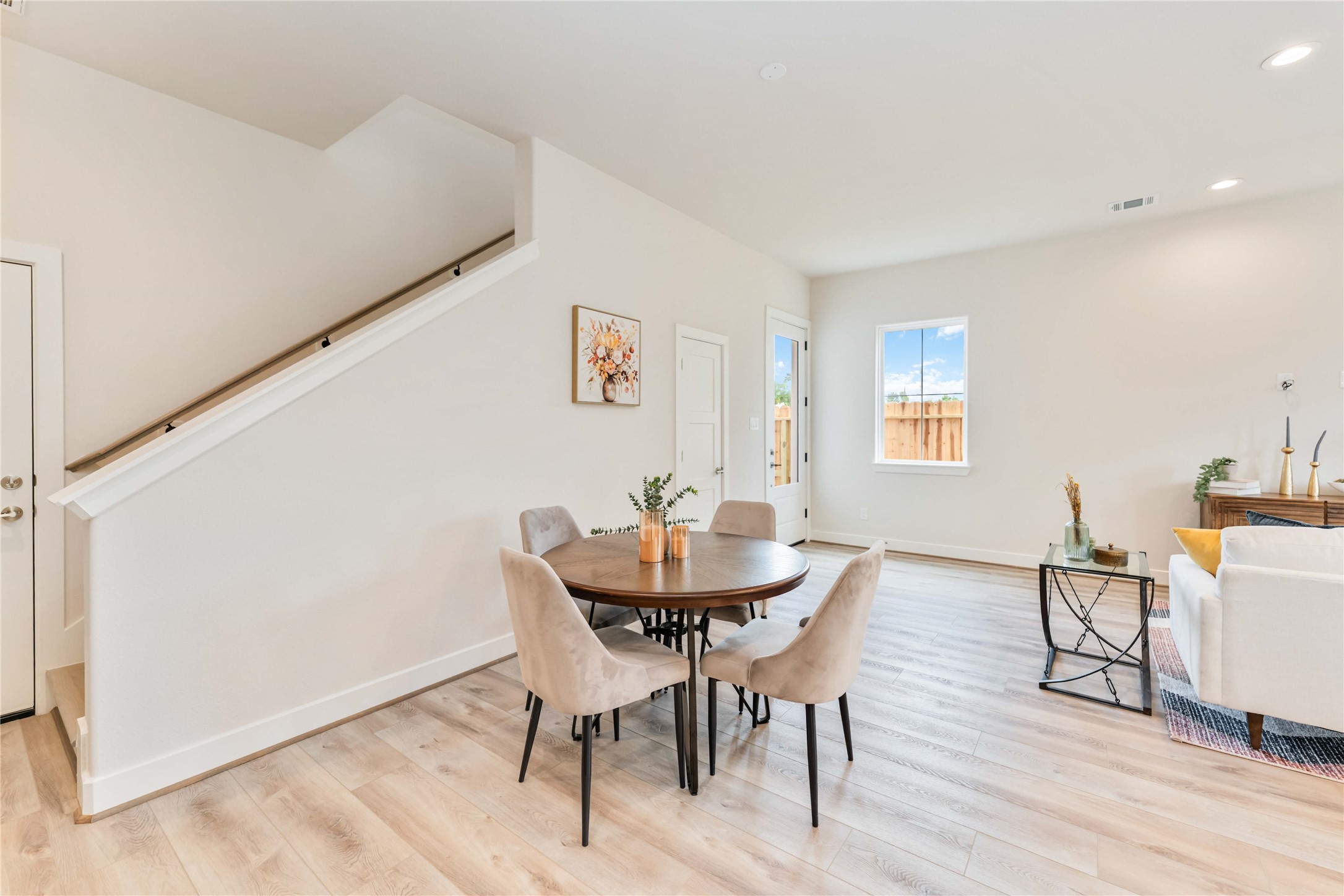 11108 Bauman Road Houston, TX 77076 - Photo 9 of 25 a view of a dining room with furniture and wooden floor
