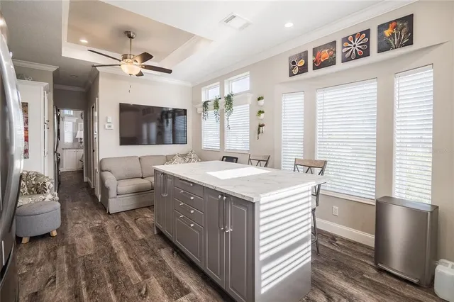 a view of living room kitchen with a sink and dishwasher