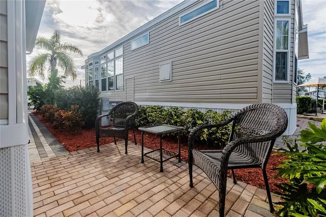 a view of a chairs and table in a patio