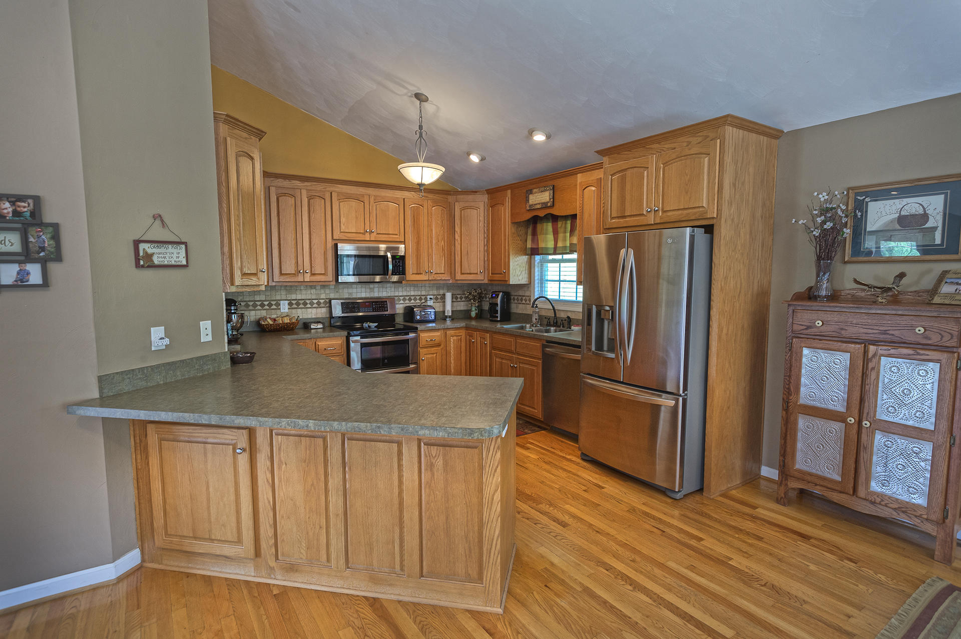 5533 Roanoke Road Troutville, VA 24175 - Photo 11 of 45 a kitchen with stainless steel appliances granite countertop a refrigerator a stove a sink and a microwave