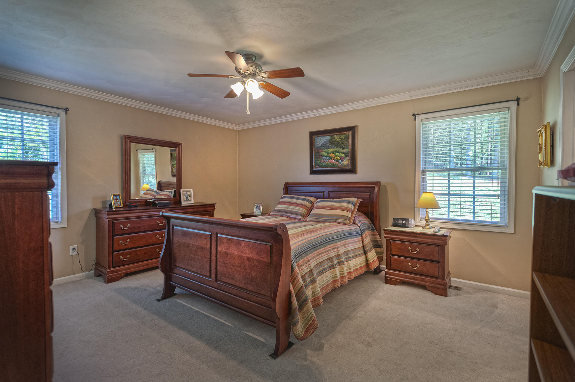 5533 Roanoke Road Troutville, VA 24175 - Photo 17 of 45 a bedroom with a bed and a chandelier