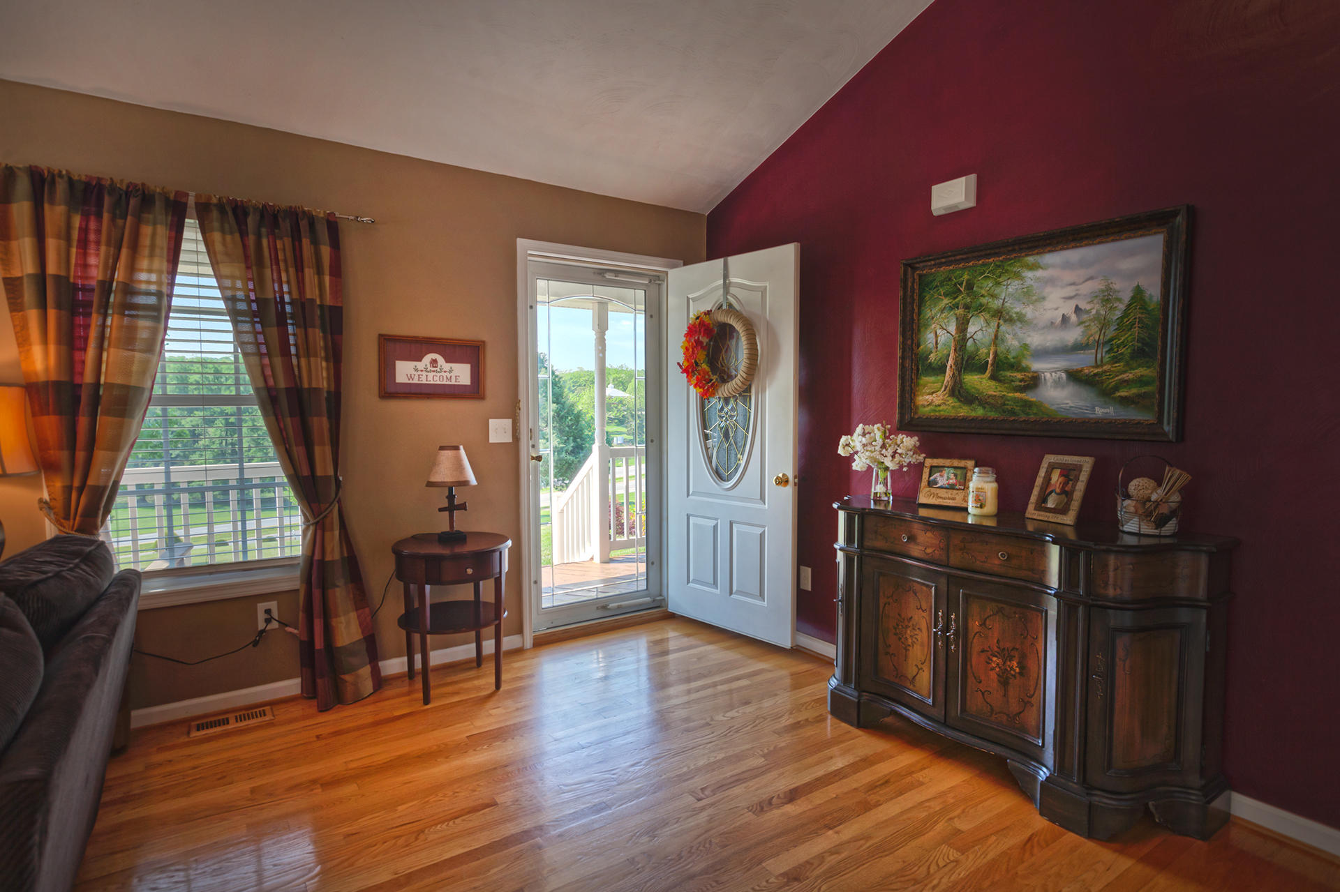 5533 Roanoke Road Troutville, VA 24175 - Photo 5 of 45 a living room with furniture flat screen tv and wooden floor