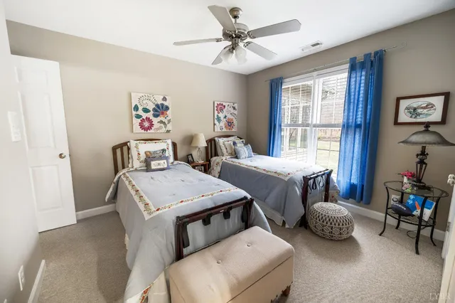 a view of a patio with a table and chairs under an umbrella