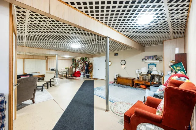 a white house that has a tree in front of it