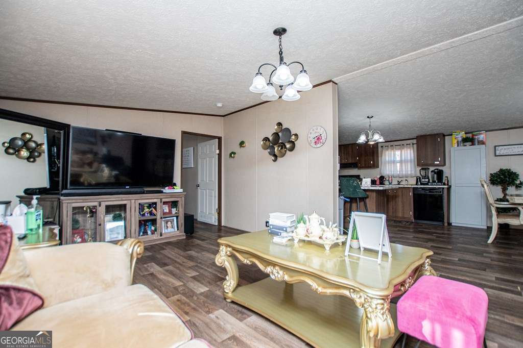 450 Glenloch Road Roopville, GA 30170 - Photo 11 of 60 a living room with furniture and a flat screen tv