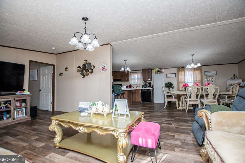 450 Glenloch Road Roopville, GA 30170 - Photo 12 of 60 a living room with fireplace furniture and a flat screen tv