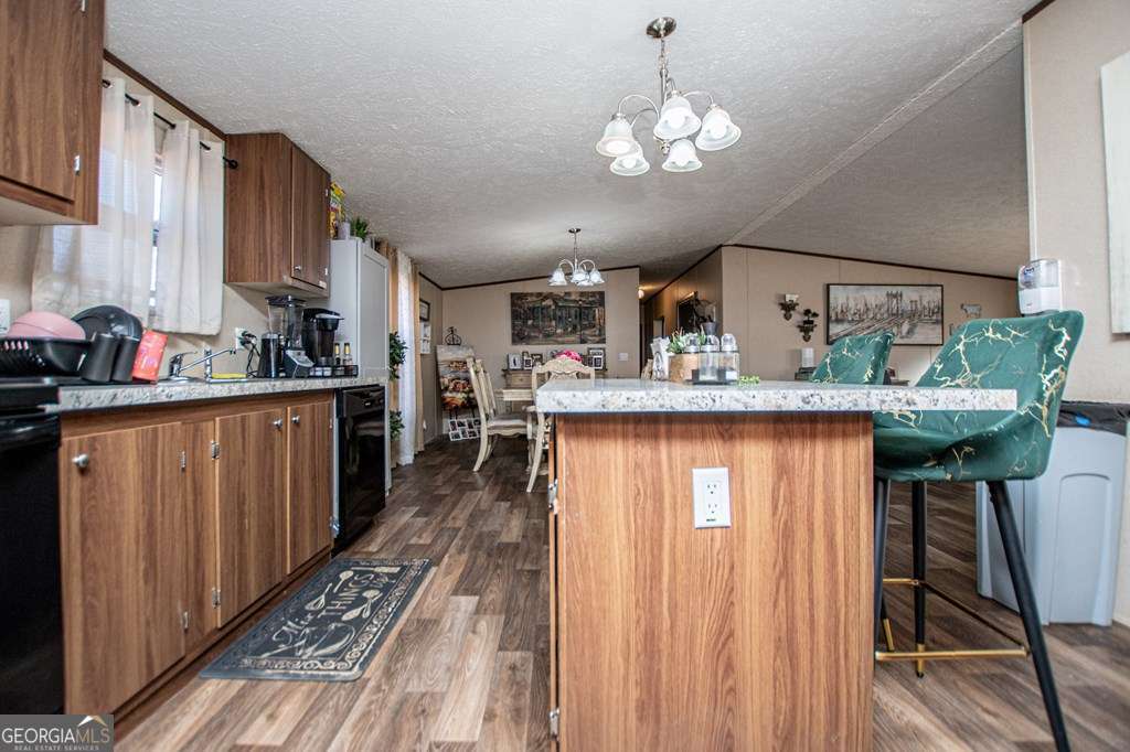 450 Glenloch Road Roopville, GA 30170 - Photo 20 of 60 a kitchen with stainless steel appliances granite countertop a stove and cabinets