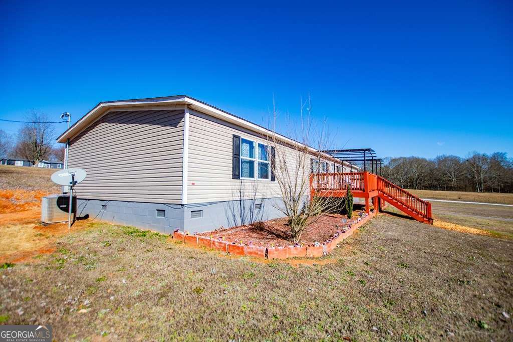 450 Glenloch Road Roopville, GA 30170 - Photo 3 of 60 a view of a house with a yard