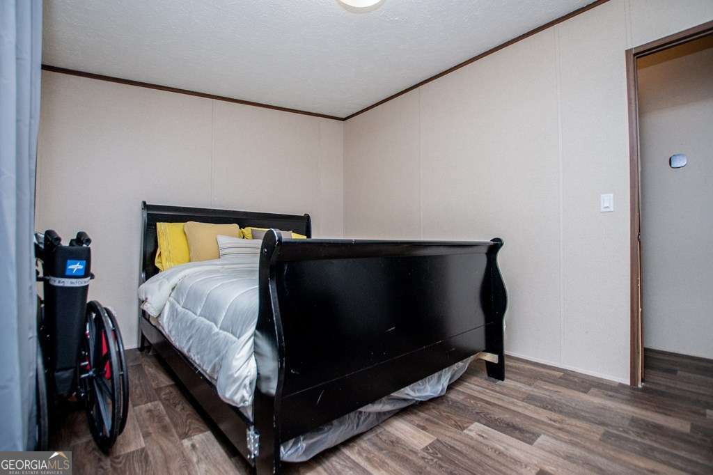 450 Glenloch Road Roopville, GA 30170 - Photo 42 of 60 a bed sitting in a bedroom next to a window