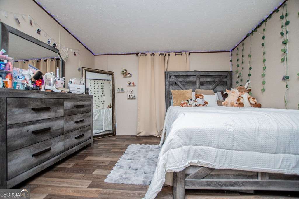 450 Glenloch Road Roopville, GA 30170 - Photo 49 of 60 a bed room with a bed and a window