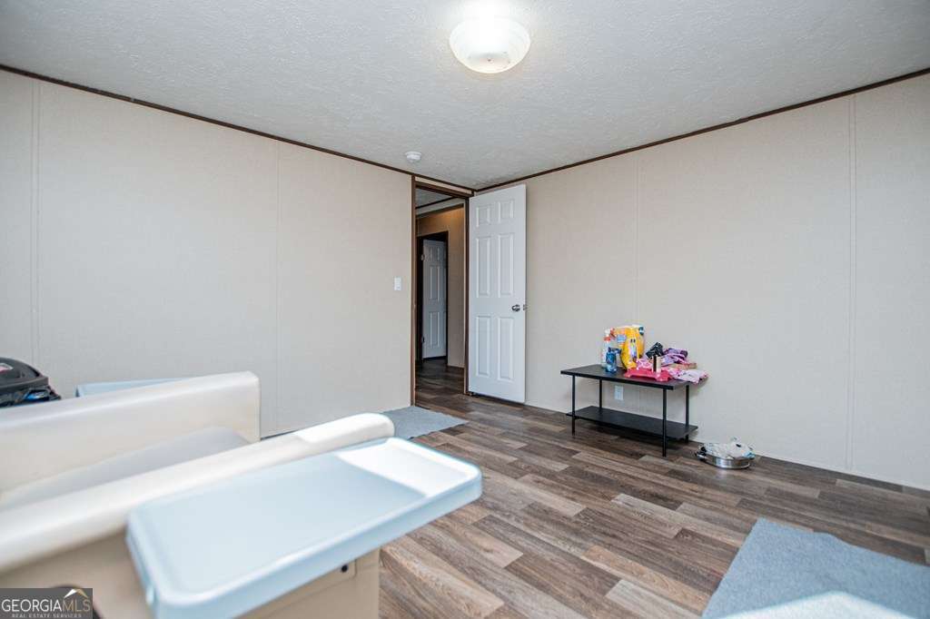 450 Glenloch Road Roopville, GA 30170 - Photo 51 of 60 a living room with furniture and wooden floor