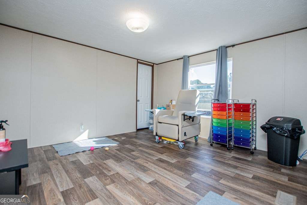 450 Glenloch Road Roopville, GA 30170 - Photo 53 of 60 a living room with furniture and a wooden floor