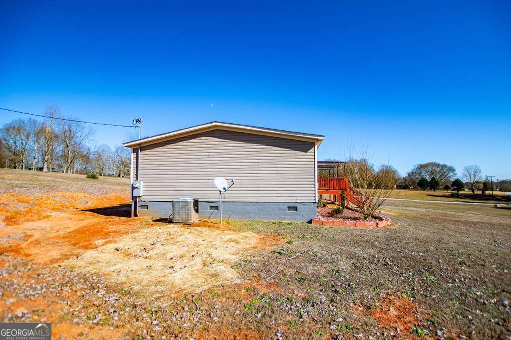 450 Glenloch Road Roopville, GA 30170 - Photo 60 of 60 a view of a house with a yard