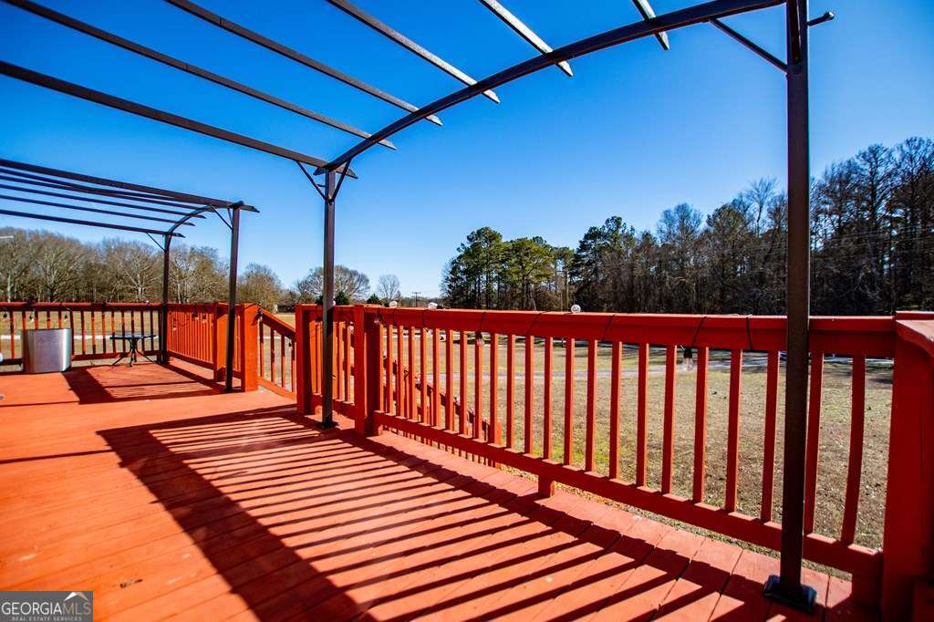 450 Glenloch Road Roopville, GA 30170 - Photo 7 of 60 a view of a balcony with wooden floor