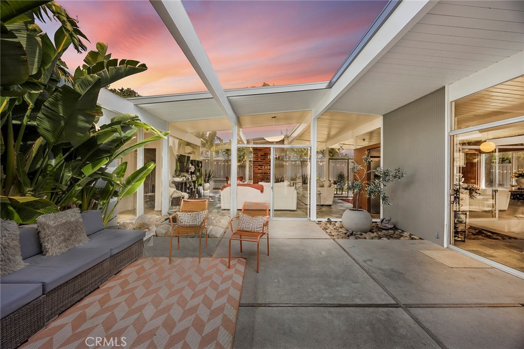 1791 North Winlock Street Orange, CA 92865 - Photo 2 of 39 a living room with patio furniture and a potted plant
