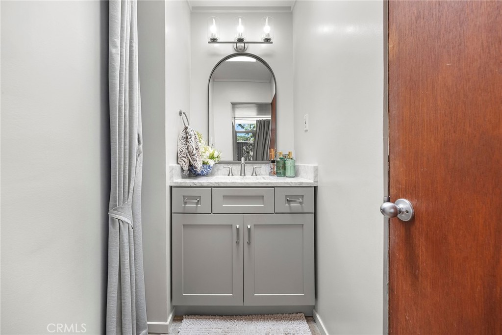 1791 North Winlock Street Orange, CA 92865 - Photo 23 of 39 a bathroom with a sink and a mirror