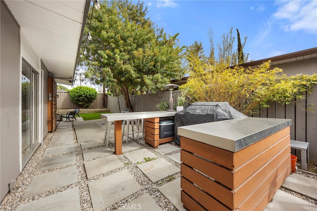 1791 North Winlock Street Orange, CA 92865 - Photo 34 of 39 a view of a patio with couches and table with potted plants