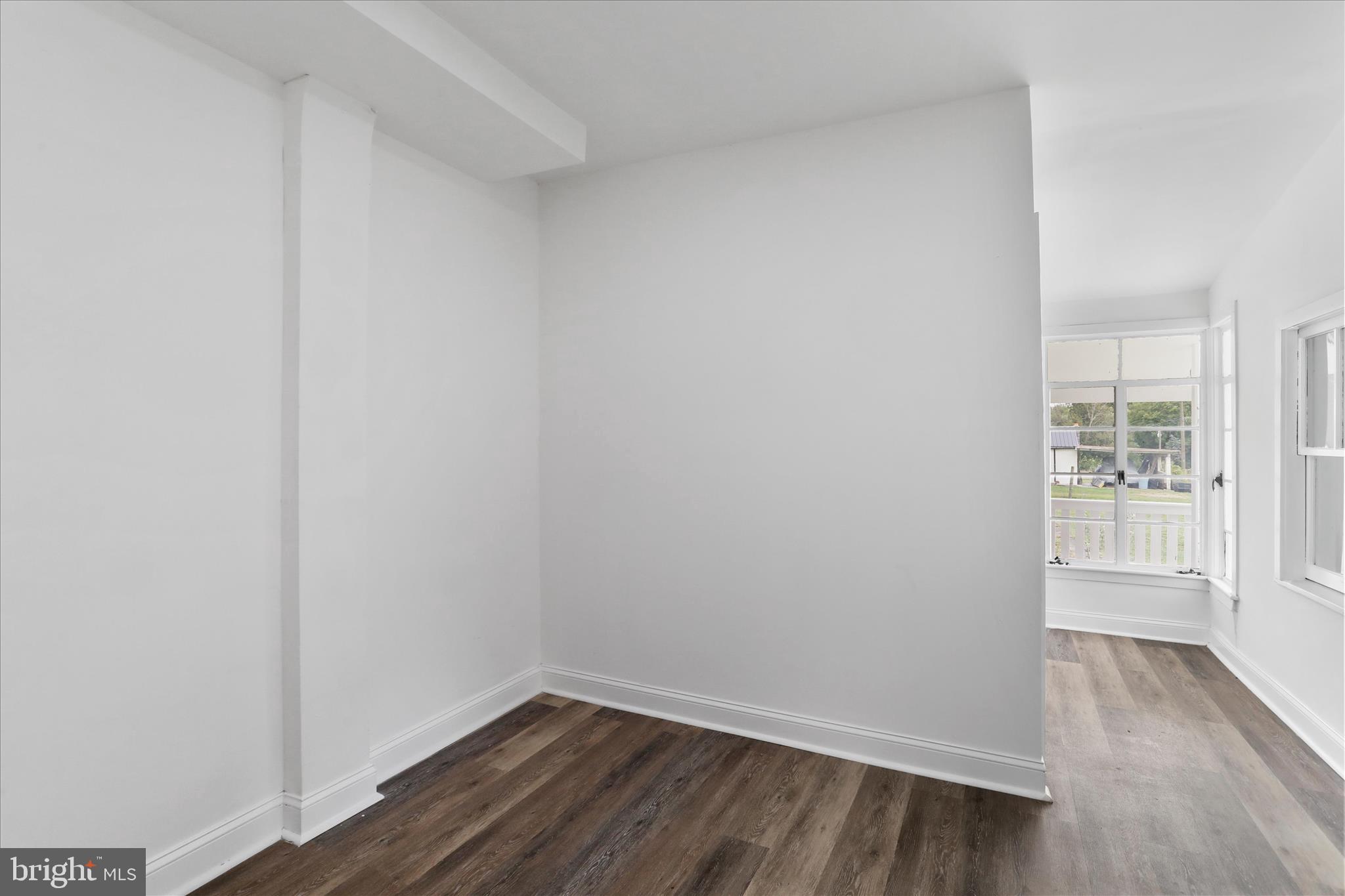 15225 Fairview Road Clear Spring, MD 21722 - Photo 19 of 43 a view of an empty room with wooden floor and a window