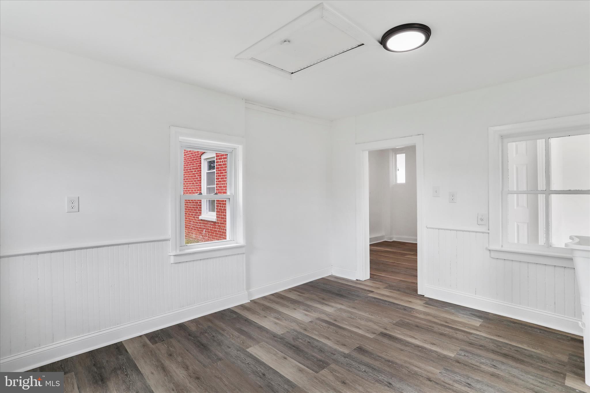 15225 Fairview Road Clear Spring, MD 21722 - Photo 22 of 43 an empty room with wooden floor and windows