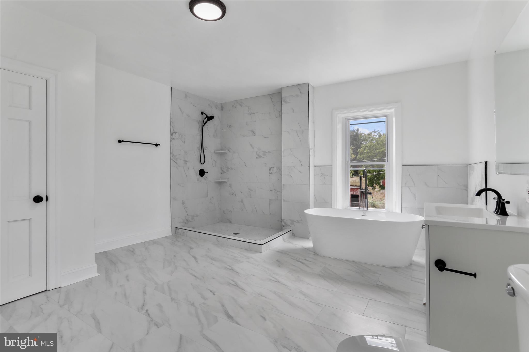 15225 Fairview Road Clear Spring, MD 21722 - Photo 28 of 43 a bathroom with a shower sink and mirror
