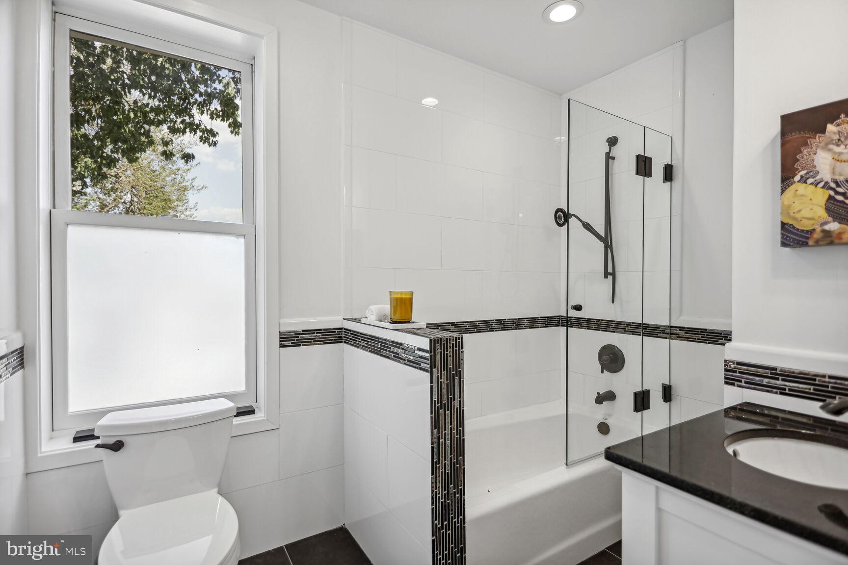 425 5th Street Northeast Washington, DC 20002 - Photo 13 of 25 a bathroom with a sink toilet and shower