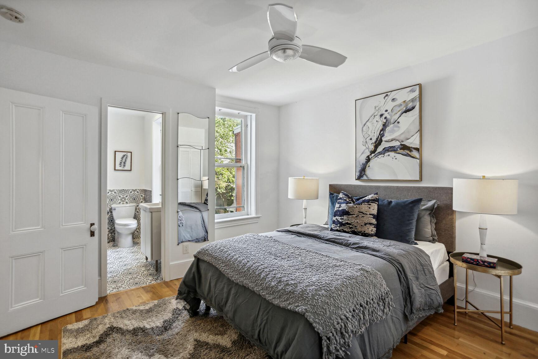 425 5th Street Northeast Washington, DC 20002 - Photo 15 of 25 a bedroom with a large bed and a chandelier