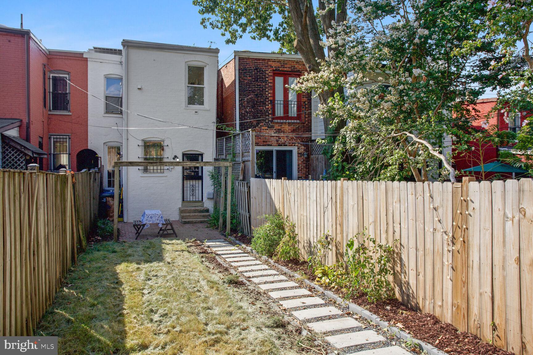 425 5th Street Northeast Washington, DC 20002 - Photo 22 of 25 a front view of a house with a garden