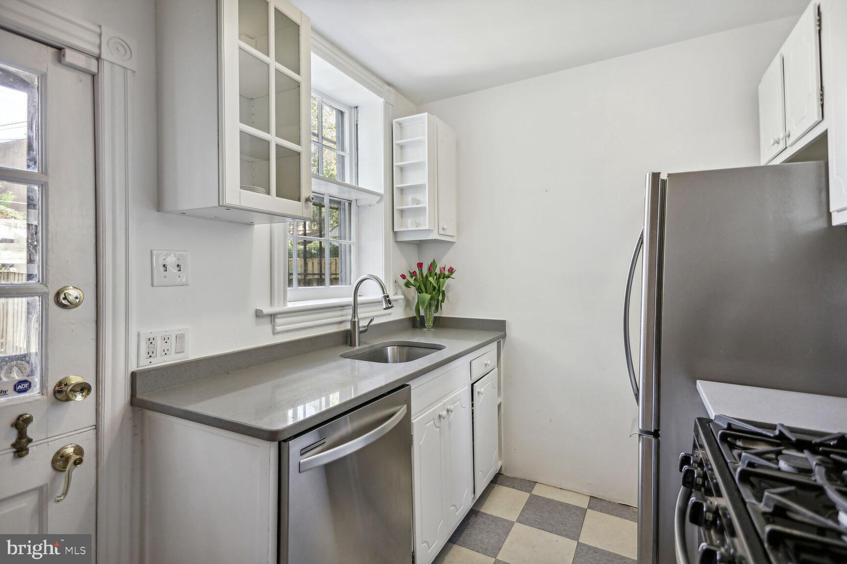 425 5th Street Northeast Washington, DC 20002 - Photo 9 of 25 a kitchen with stainless steel appliances granite countertop a sink and a refrigerator