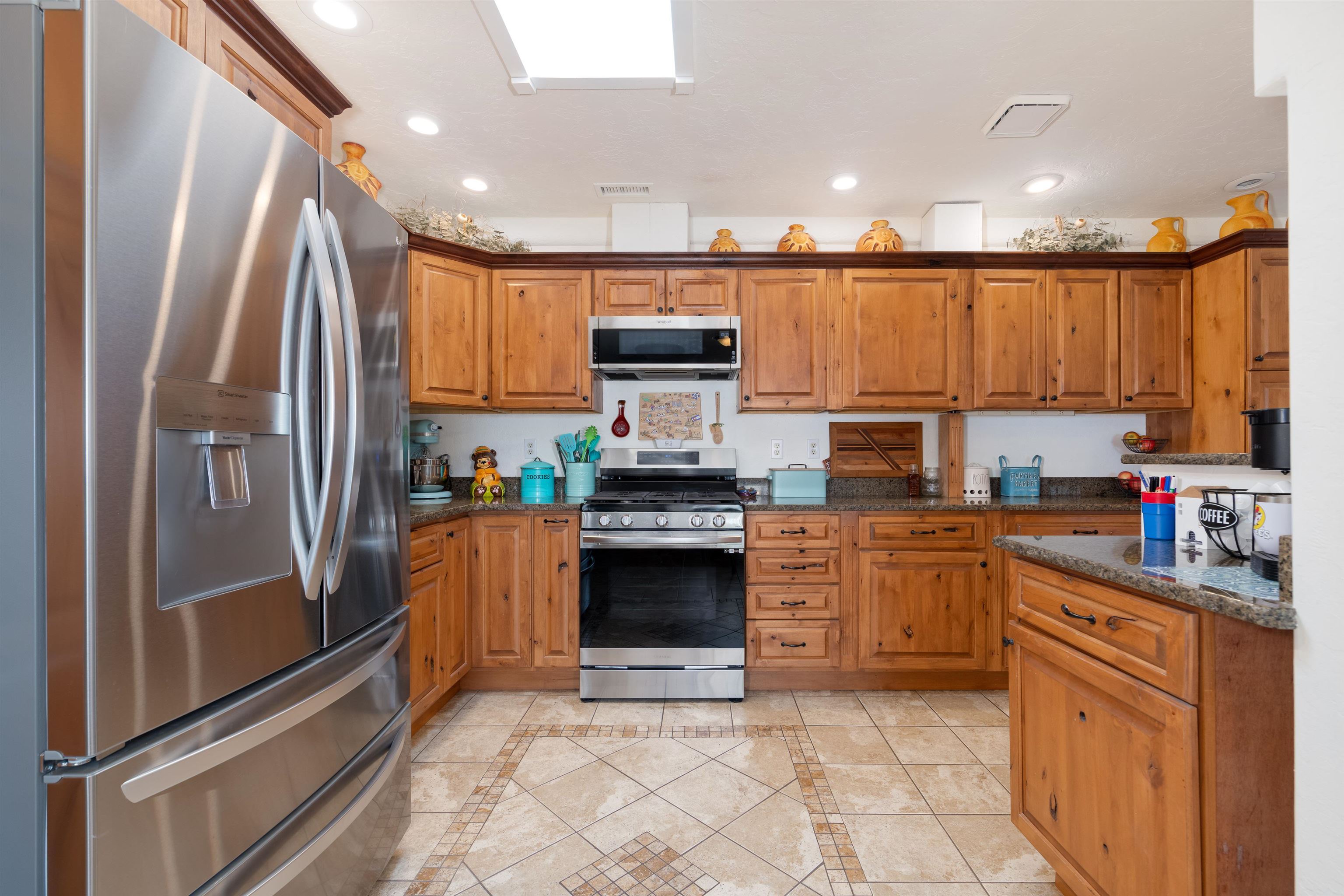 33376 Mill Tailing Road Whitewater, CO 81527 - Photo 11 of 42 a kitchen with stainless steel appliances granite countertop a refrigerator and a stove top oven