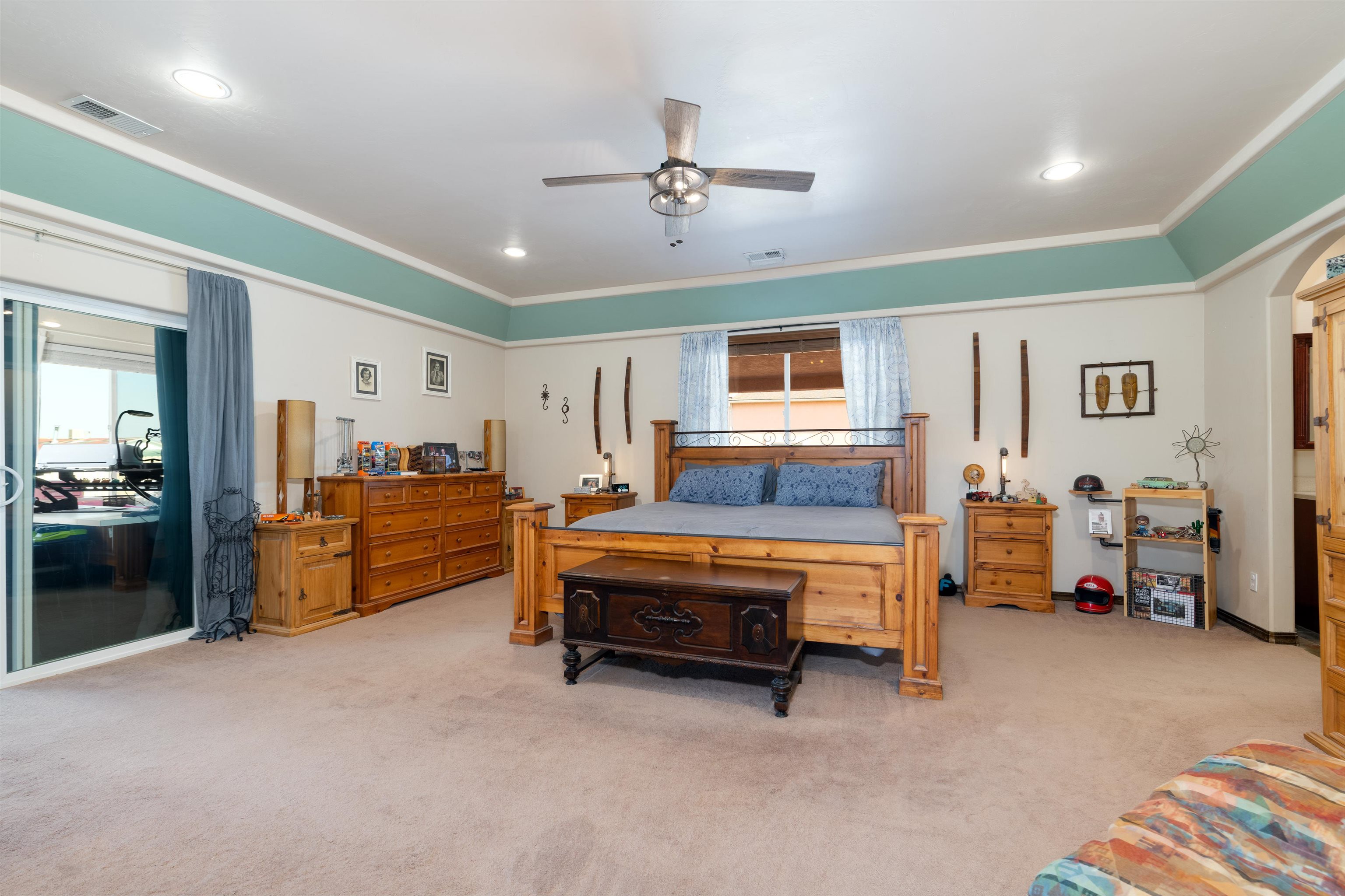 33376 Mill Tailing Road Whitewater, CO 81527 - Photo 14 of 42 a bedroom with furniture and a chandelier