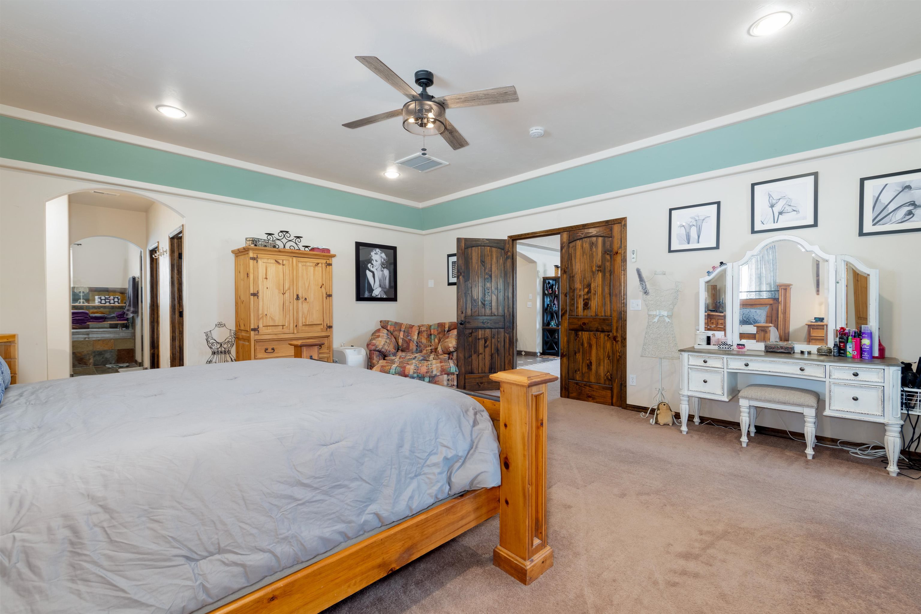 33376 Mill Tailing Road Whitewater, CO 81527 - Photo 15 of 42 a bedroom with furniture and a chandelier