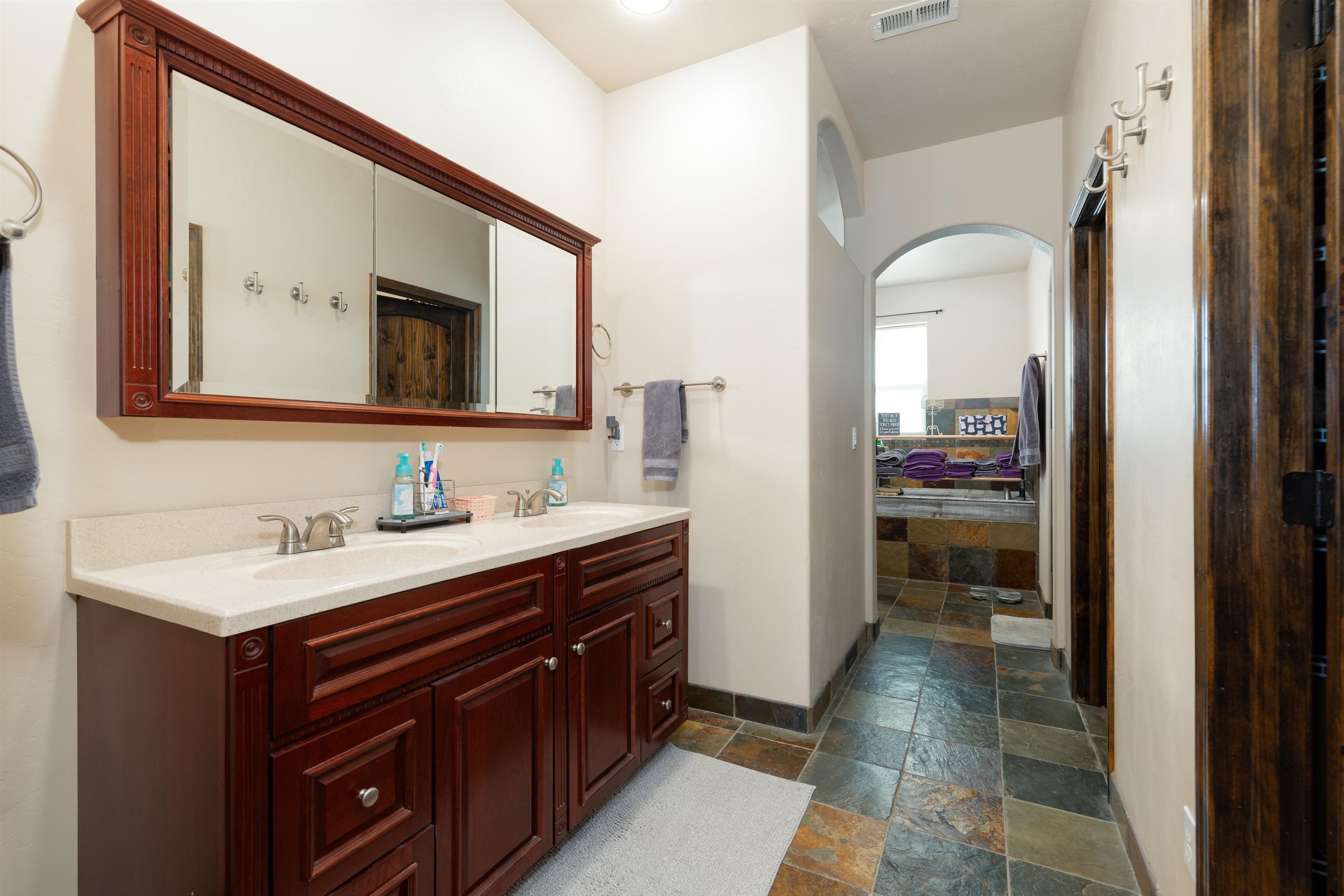 33376 Mill Tailing Road Whitewater, CO 81527 - Photo 16 of 42 a bathroom with a sink a toilet and mirror