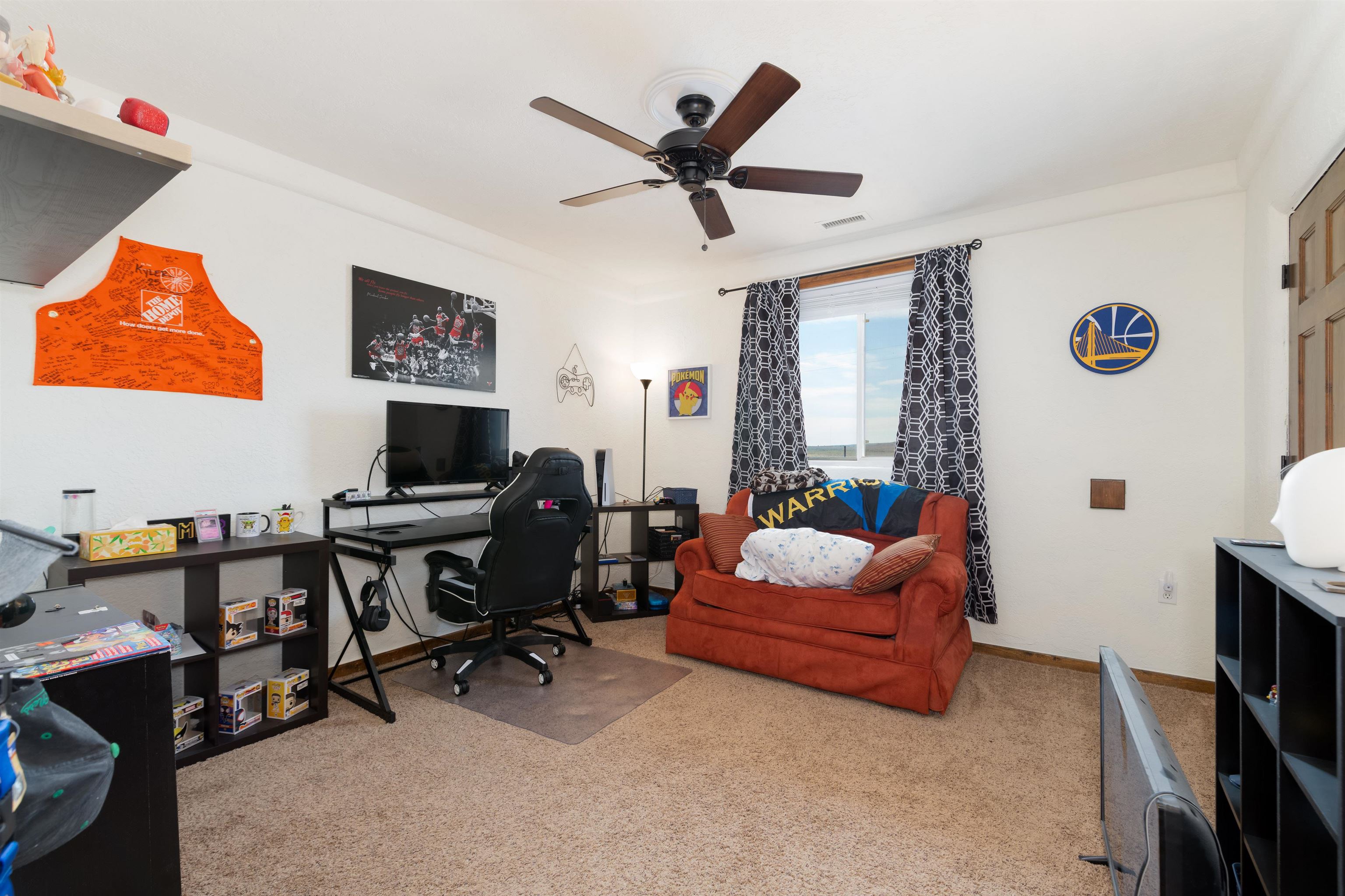 33376 Mill Tailing Road Whitewater, CO 81527 - Photo 21 of 42 a living room with furniture and a flat screen tv