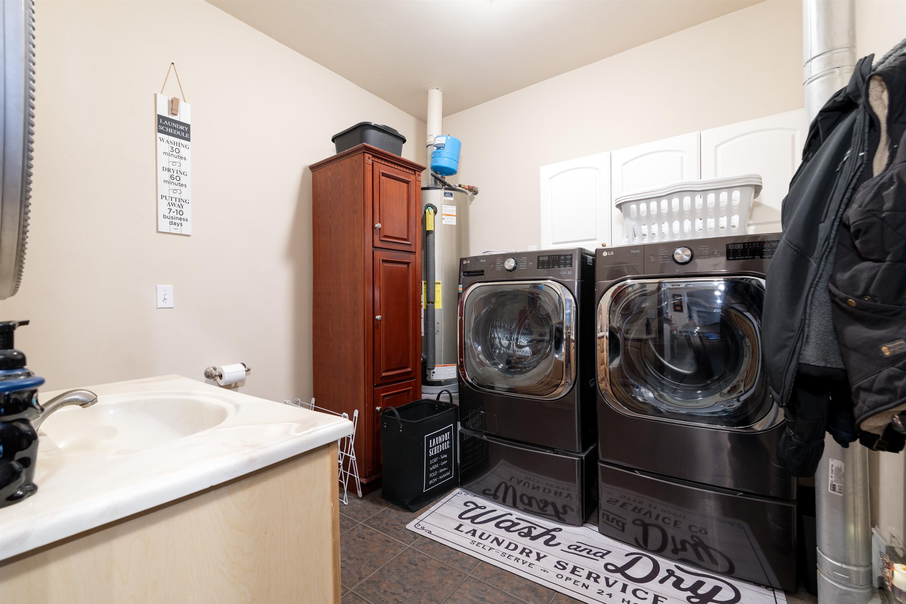 33376 Mill Tailing Road Whitewater, CO 81527 - Photo 24 of 42 a utility room with dryer and washer