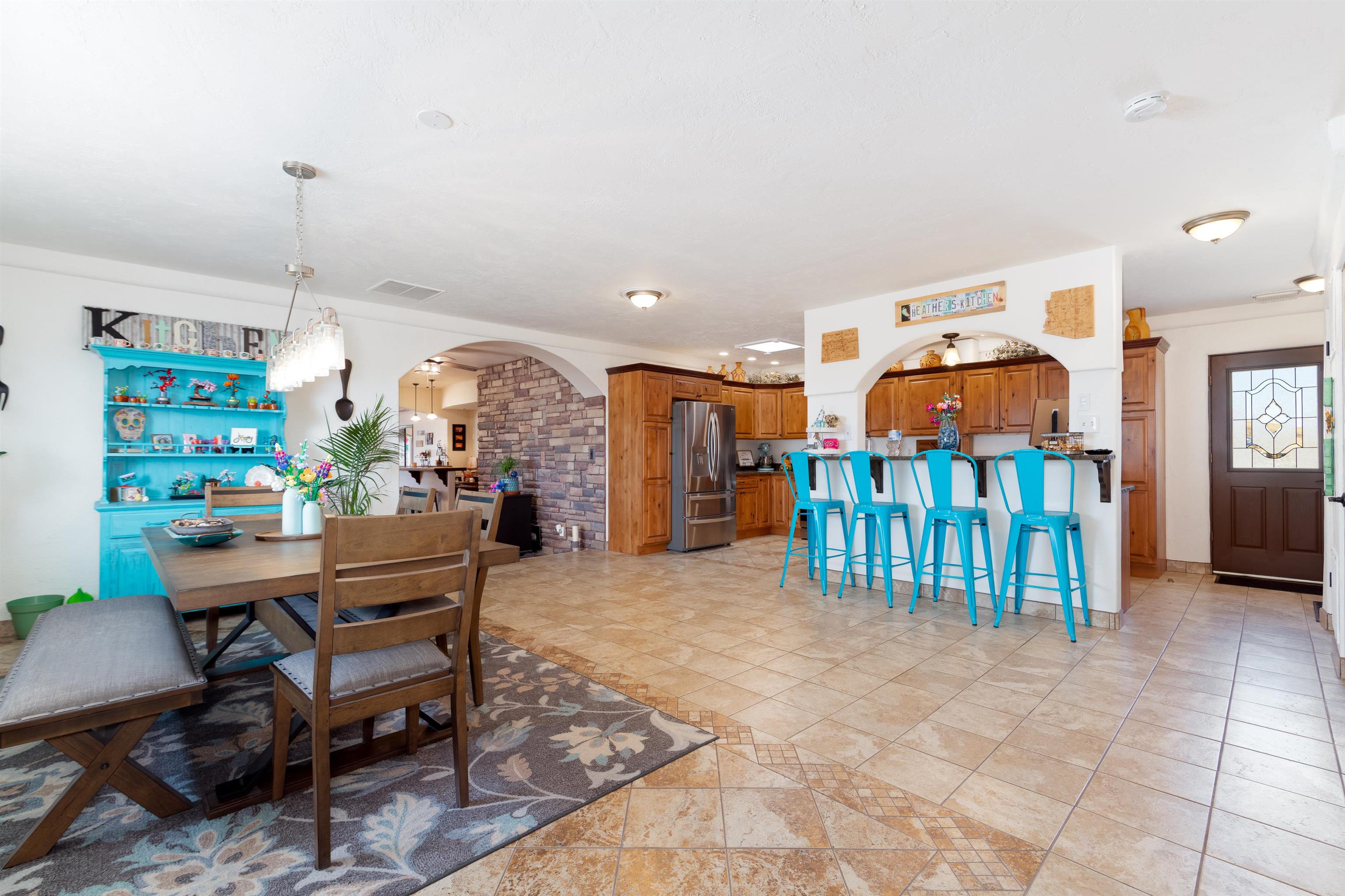 33376 Mill Tailing Road Whitewater, CO 81527 - Photo 7 of 42 a living room with lots of furniture and a chandelier