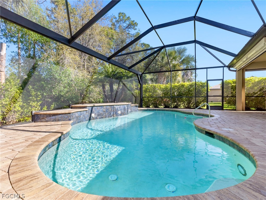 10878 Dennington Road Fort Myers, FL 33913 - Photo 11 of 50 a view of a swimming pools under an umbrella