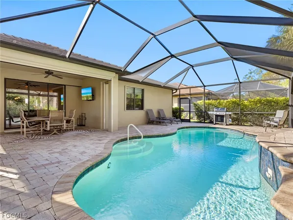 a view of a swimming pool with a patio