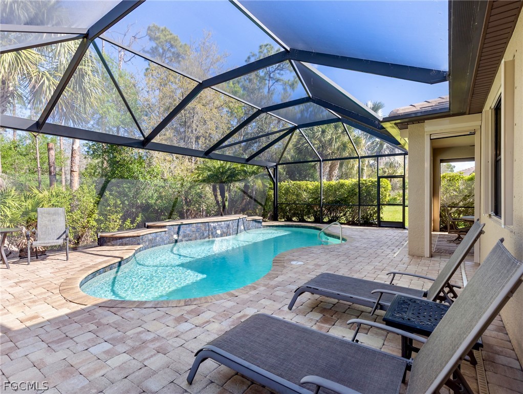 10878 Dennington Road Fort Myers, FL 33913 - Photo 14 of 50 a patio with a yard table and chairs