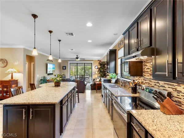 a kitchen with sink stove and cabinets