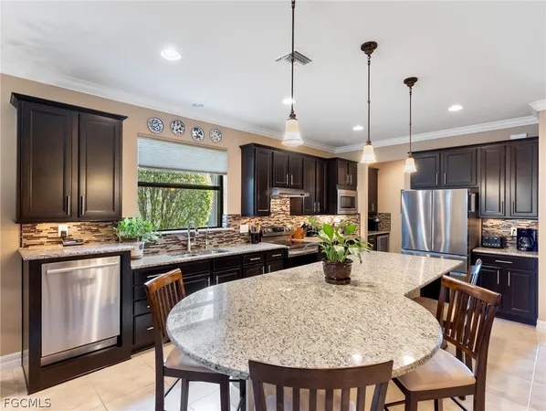 a kitchen with a table and chairs