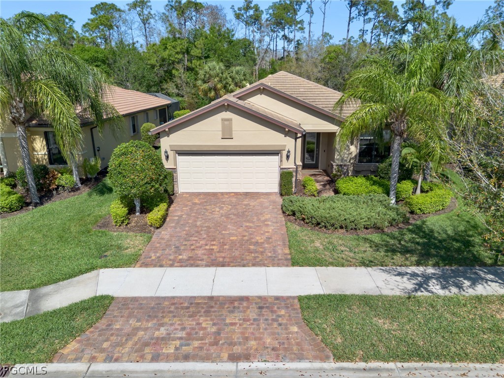 10878 Dennington Road Fort Myers, FL 33913 - Photo 42 of 50 a front view of house with yard and green space