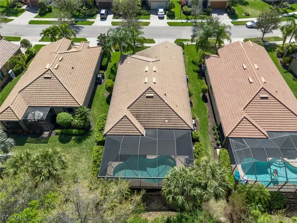 an aerial view of residential houses with outdoor space