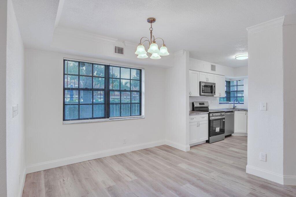 17388 Boca Club Boulevard, Unit 201 Boca Raton, FL 33487 - Photo 13 of 44 Dining to Kitchen.jpg-SMALL