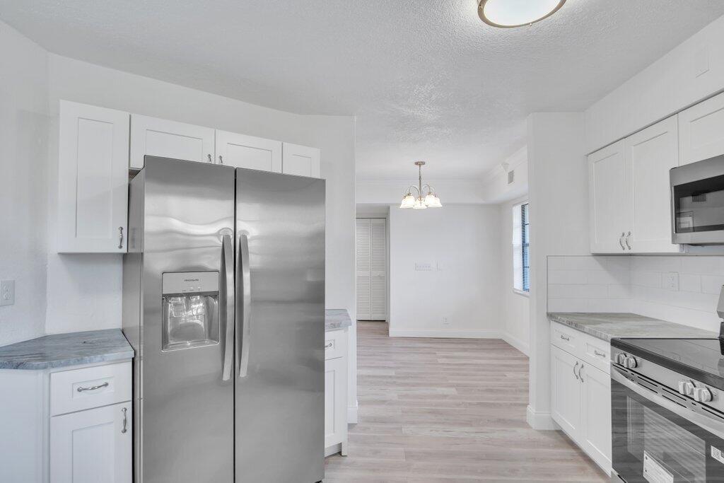 17388 Boca Club Boulevard, Unit 201 Boca Raton, FL 33487 - Photo 10 of 44 Kitchen to Dining.jpg-SMALL