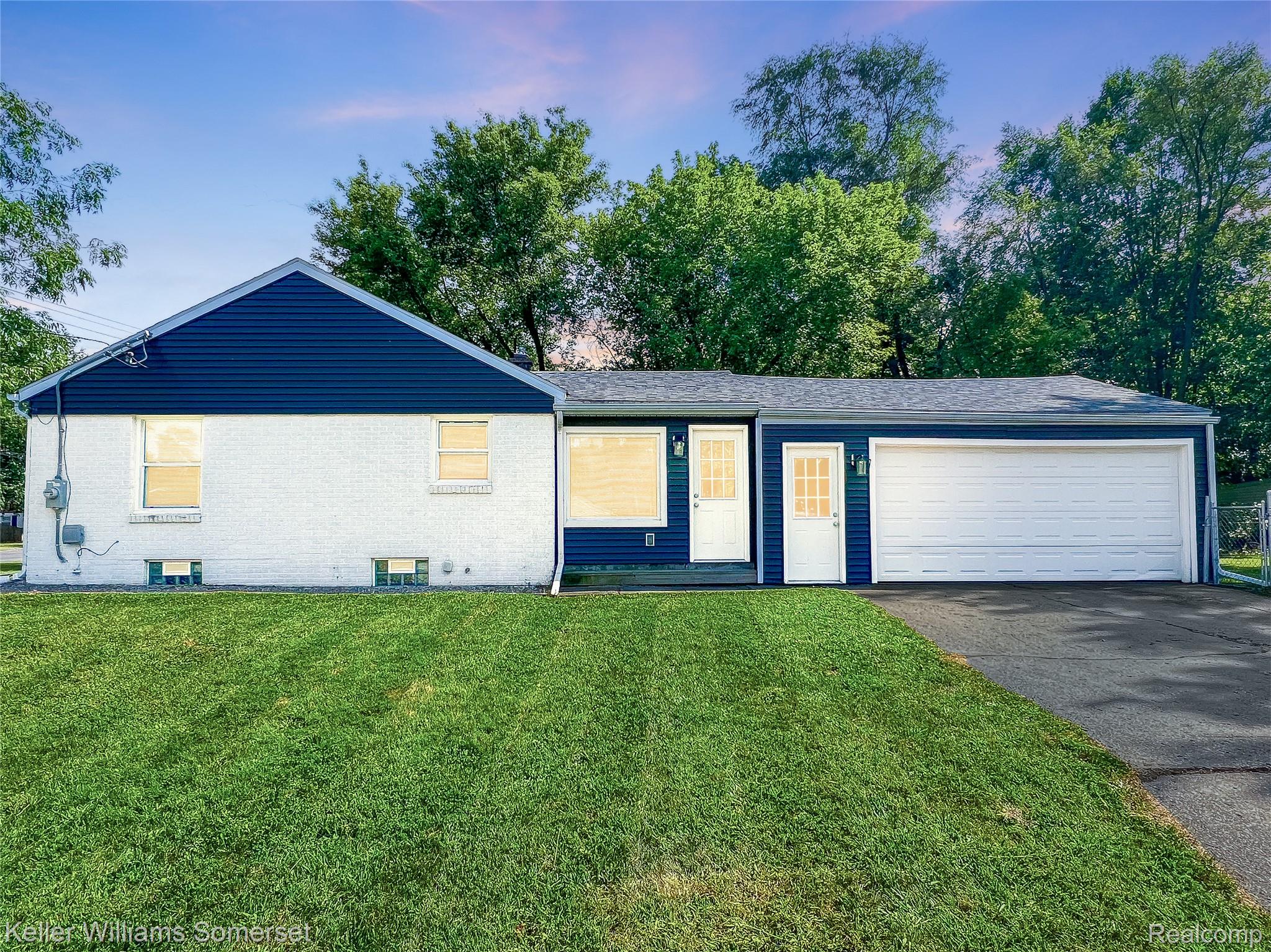 1821 Nazareth Road Kalamazoo, MI 49048 - Photo 4 of 20 Ranch-style exterior featuring white brick and dark blue siding