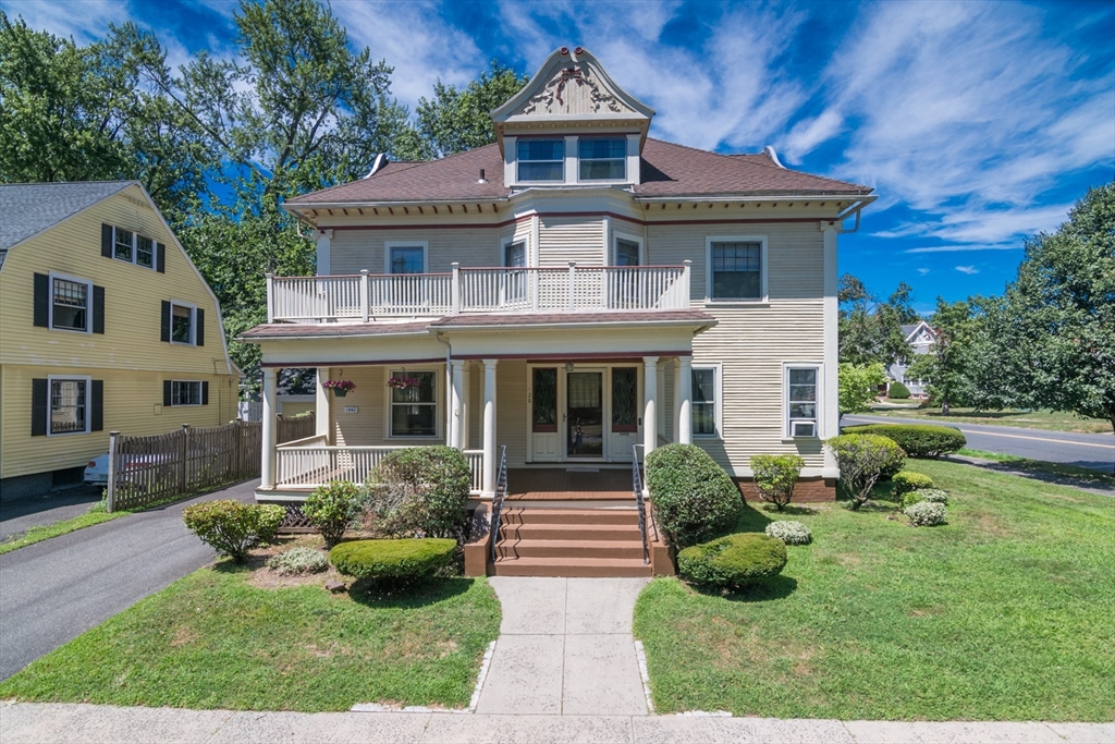 128 Maplewood Terrace Springfield, MA 01108 - Photo 1 of 42 a front view of a house with a yard
